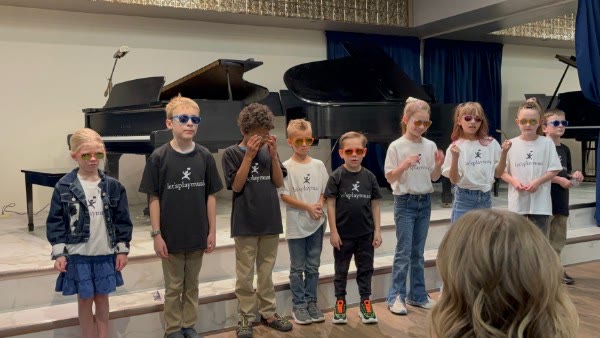 Children together after a music performance